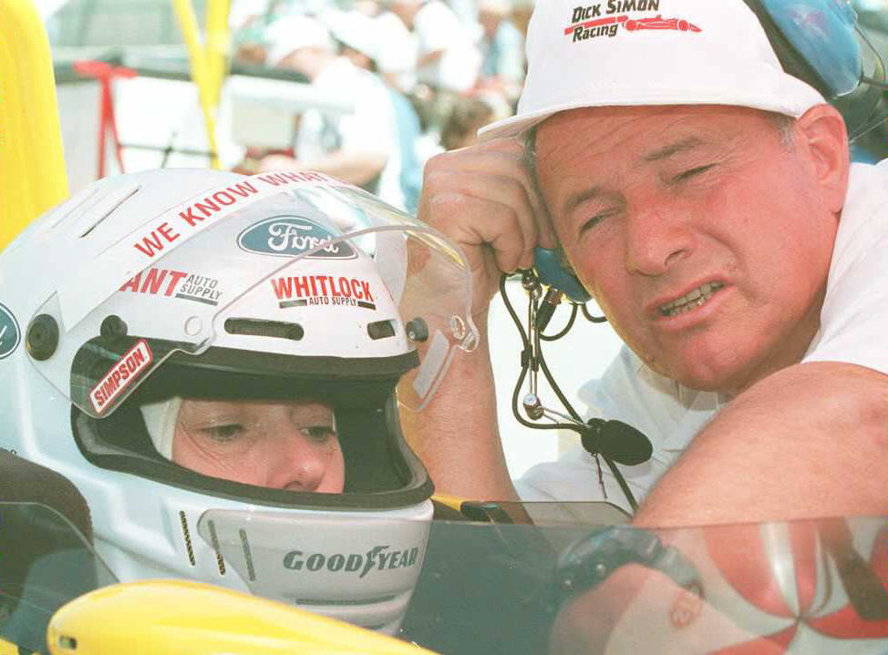 Car owner Dick Simon(R) confers with US driver Lyn St. James(L) during practice 19 May for the 79th Indianapolis 500. St. James, who is the lone female entrant in this year's race, has competed in three previous Indy 500s. (Photo by ANN MILLER CARR/AFP via Getty Images)