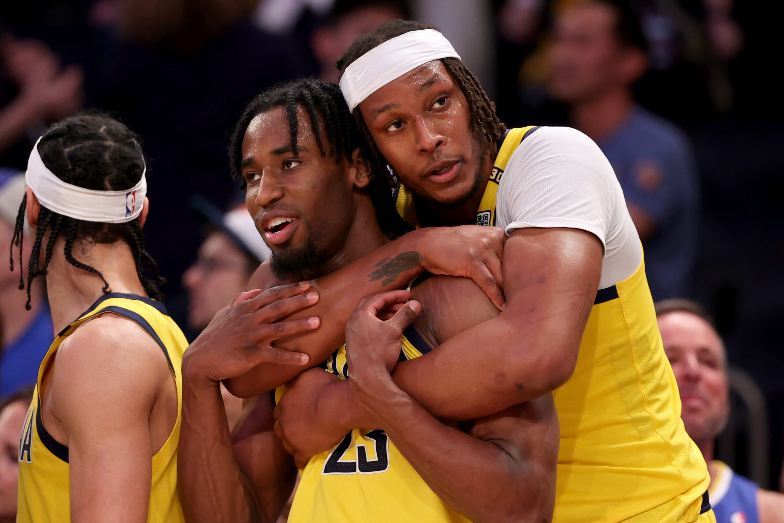 Aaron Nesmith #23 and Myles Turner #33 of the Indiana Pacers celebrate after beating the New York Knicks 130-109 in Game Seven of the Eastern Conference Second Round Playoffs at Madison Square Garden on May 19, 2024 in New York City. (Photo by Elsa/Getty Images)