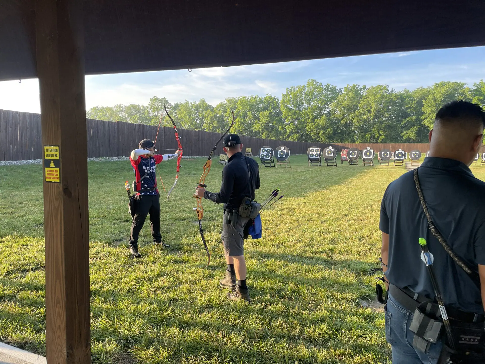 Competitors preparing for upcoming field archery competition.