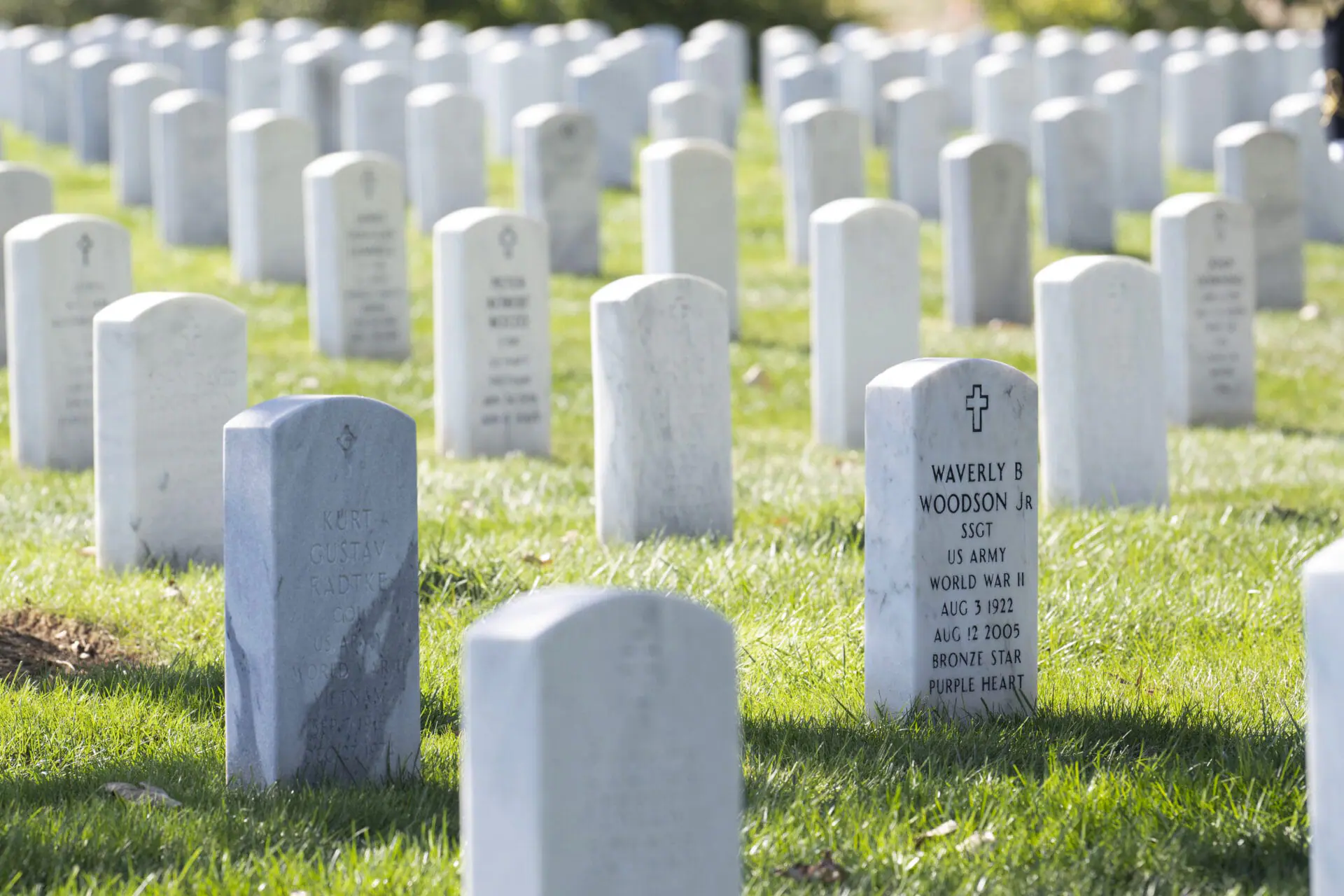 The headstone of Cpl. Waverly B. Woodson Jr. is seen during a ceremony at Arlington National Cemetery, Oct. 11, 2023, in Arlington, Va. Woodson Jr., a medic who was part of the only Black combat unit to take part in the D-Day invasion of France, is being posthumously awarded the Distinguished Service Cross. It's the military's second highest honor. The announcement was made Monday, June 3, 2024, by Sen. Chris Van Hollen of Maryland. (AP Photo/Kevin Wolf, File)