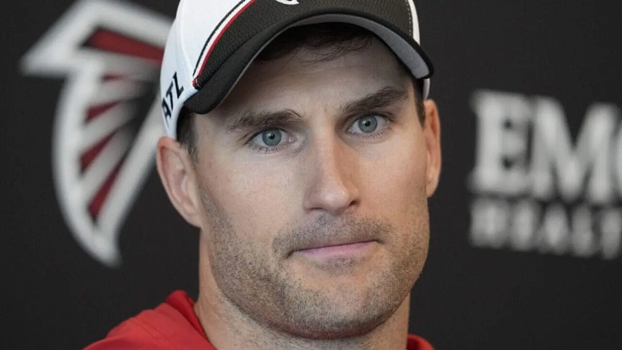 FILE - Atlanta Falcons quarterback Kirk Cousins speaks during a news conference after an NFL football practice Tuesday, May 14, 2024, in Flowery Branch, Ga. The Atlanta Falcons were stripped of a fifth-round pick in next year's draft on Thursday, June 13, for violating the NFL’s anti-tampering rules prior to signing quarterback Kirk Cousins.(AP Photo/Brynn Anderson, File)