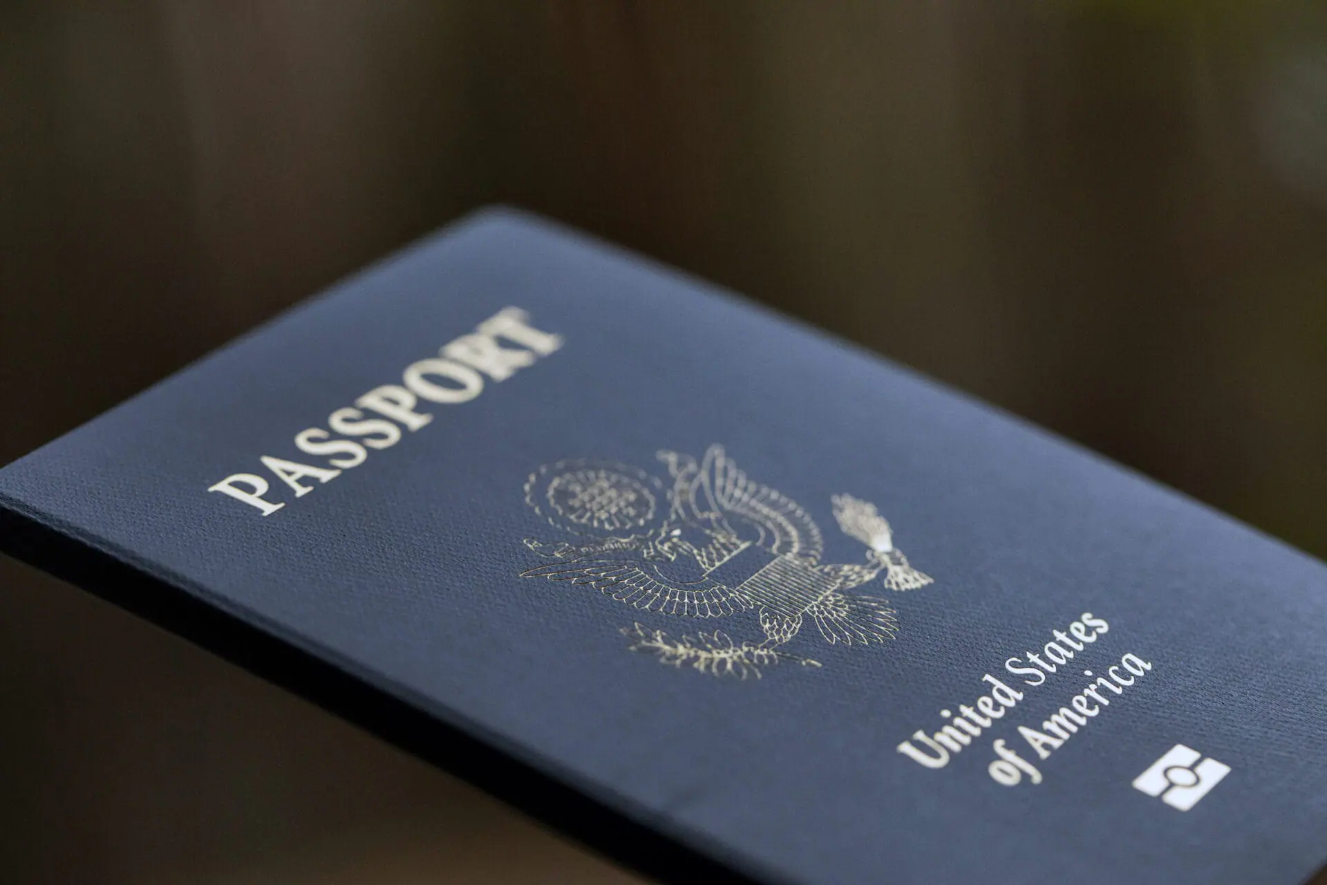 FILE - The cover of a U.S. Passport is displayed in Tigard, Ore., Dec. 11, 2021. The State Department has opened a trial run allowing a limited number of people to apply to renew their passports online. (AP Photo/Jenny Kane, File)