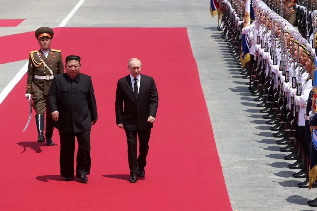 Russian President Vladimir Putin (R) and North Korean Supreme Leader Kim Jong Un attend a welcoming ceremony on June 19 in Pyongyang, North Korea. (Photo by Stringer/Getty Images via CNN Newsource)