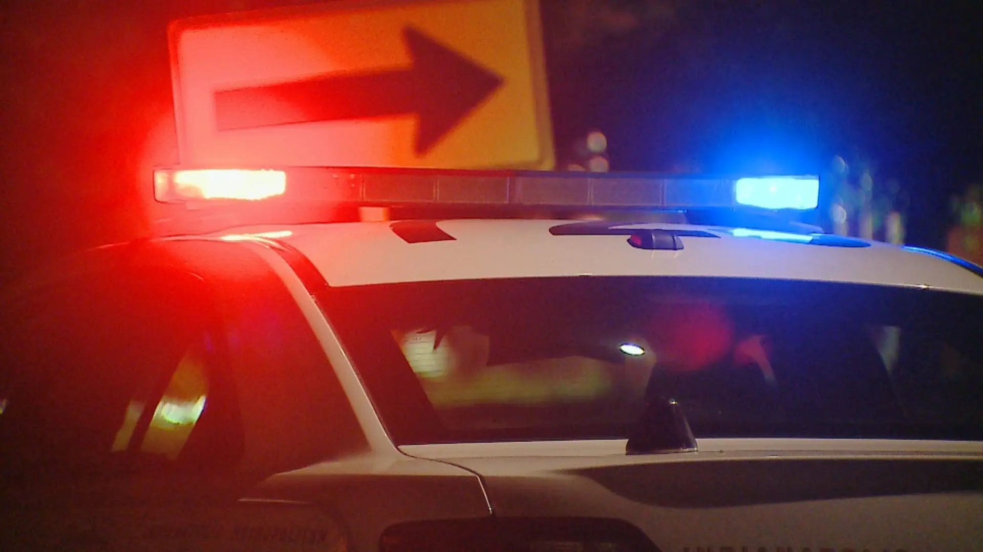 Emergency lights on top of a police car at a crime scene. (WISH Photo)