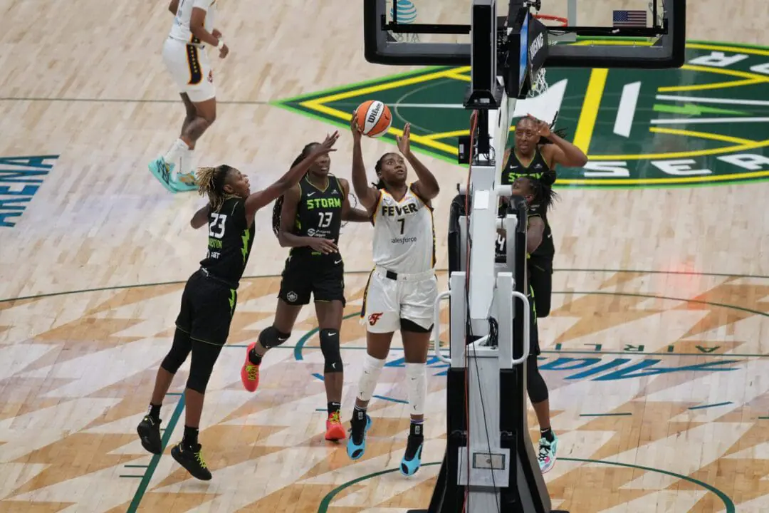 SEATTLE, WA - JUNE 27: Indiana Fever forward Aliyah Boston (7) puts up a shot surrounded by Storm players during an WNBA game between the Seattle Storm and the Indiana Fever on June 27, 2024 at Climate Pledge Arena in Seattle, WA. (Photo by Jeff Halstead/Icon Sportswire via Getty Images)