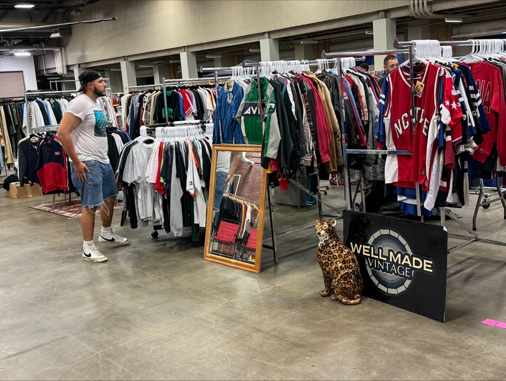 A shopper looks through clothing at the Indiana Vintage Market at the Indiana State Fairgrounds on June 29, 2024.