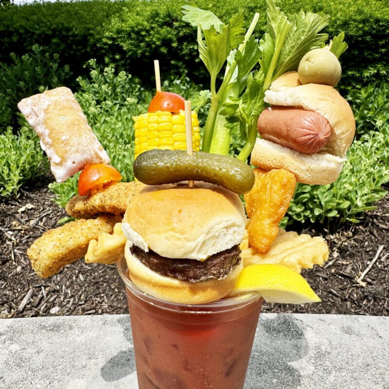 All-American Mary | Urick Concessions The All-American Mary is a classic bloody Mary decorated with all of the classic "backyard cookout foods": Mini corn on the cob, cheeseburger slider, fried mac and cheese, fried pickles, waffle fries, hotdog slider, and a mini apple pie. (Provided Photo/Indiana State Fair)