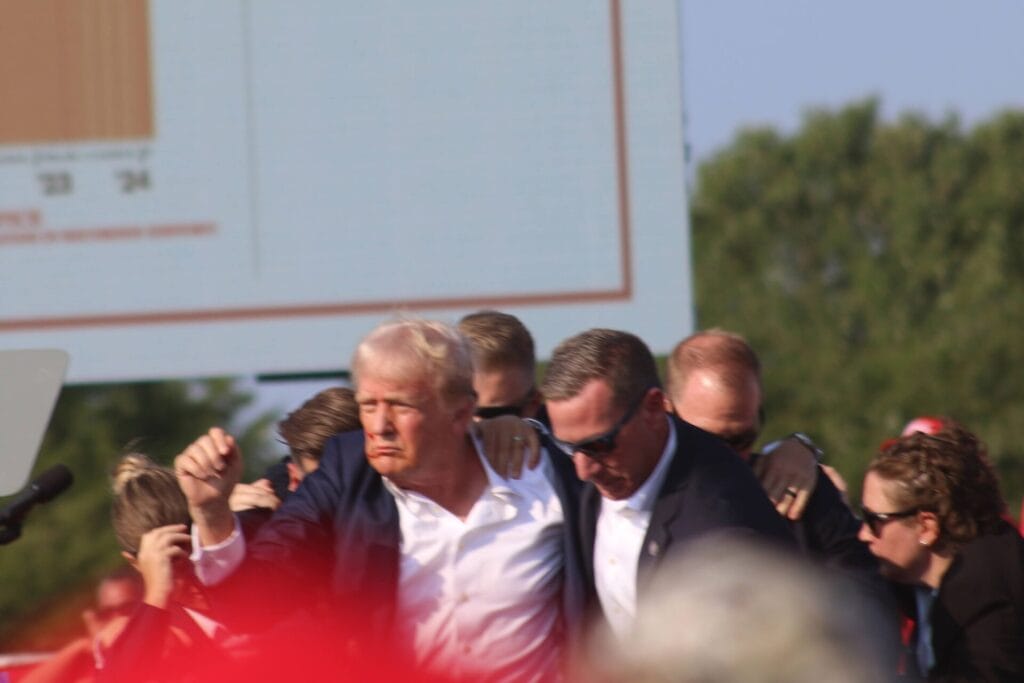 Former President Donald Trump being escorted away by Secret Service agents after being shot during a rally in Butler, Pennsylvania, on July 13, 2024. (Provided Photo/Josh Drespling)