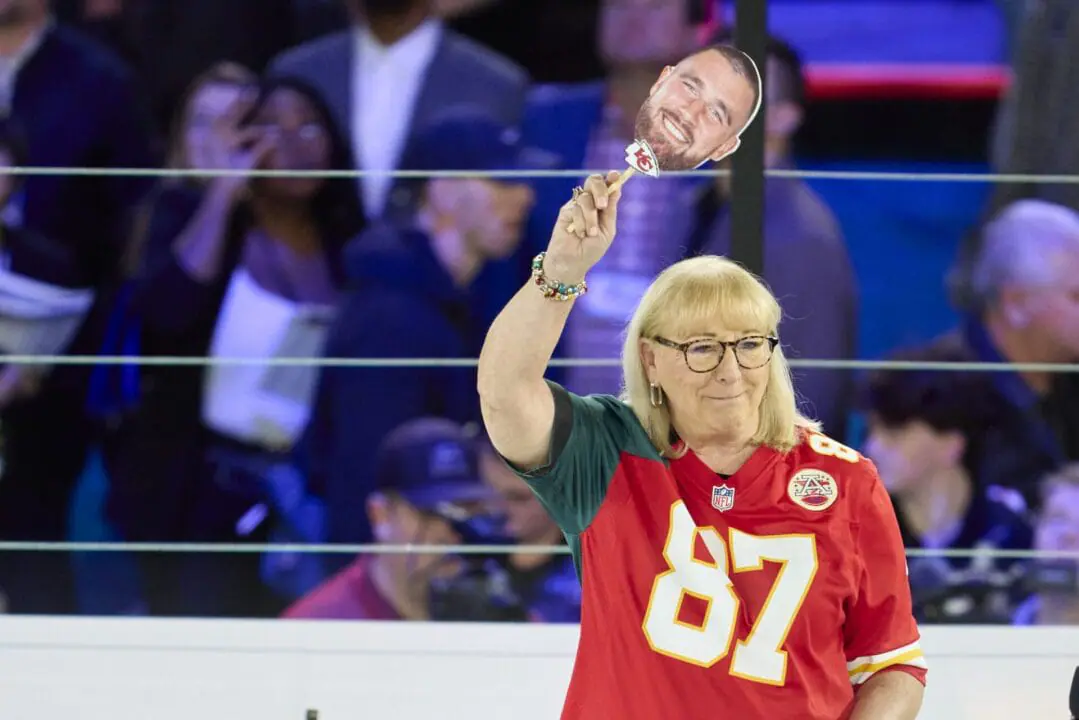 Donna Kelce, seen holding up a photo of her son Travis Kelce of the Kansas City Chiefs in 2023, has been casted in a upcoming Hallmark Channel Christmas movie. (Photo by Cooper Neill/Getty Images/File via CNN Newsource)