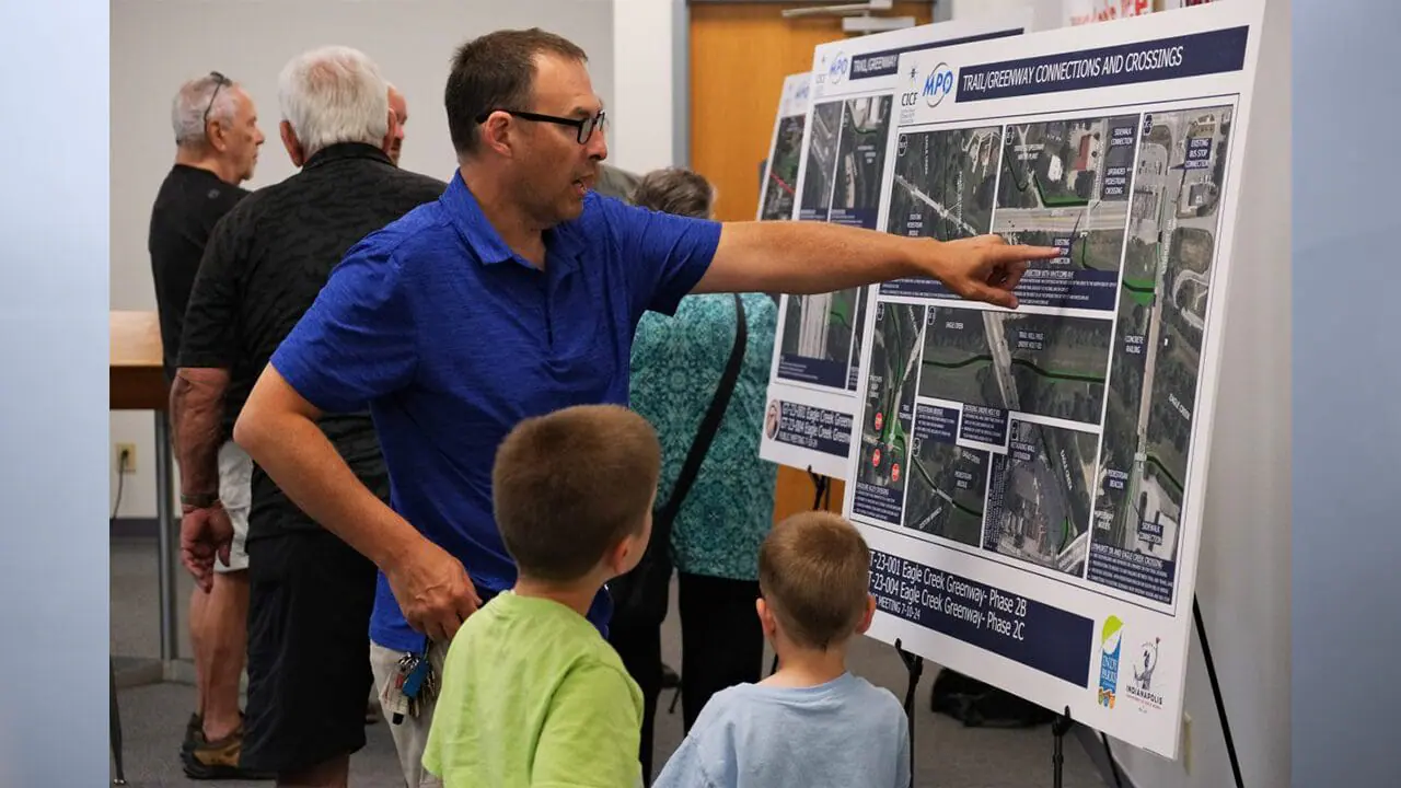 Speedway resident Donovan Miller points out a future Eagle Creek Trail crosswalk at the Pike Township Government Building July 10, 2024. (Photo by Enrique Saenz/Mirror Indy)