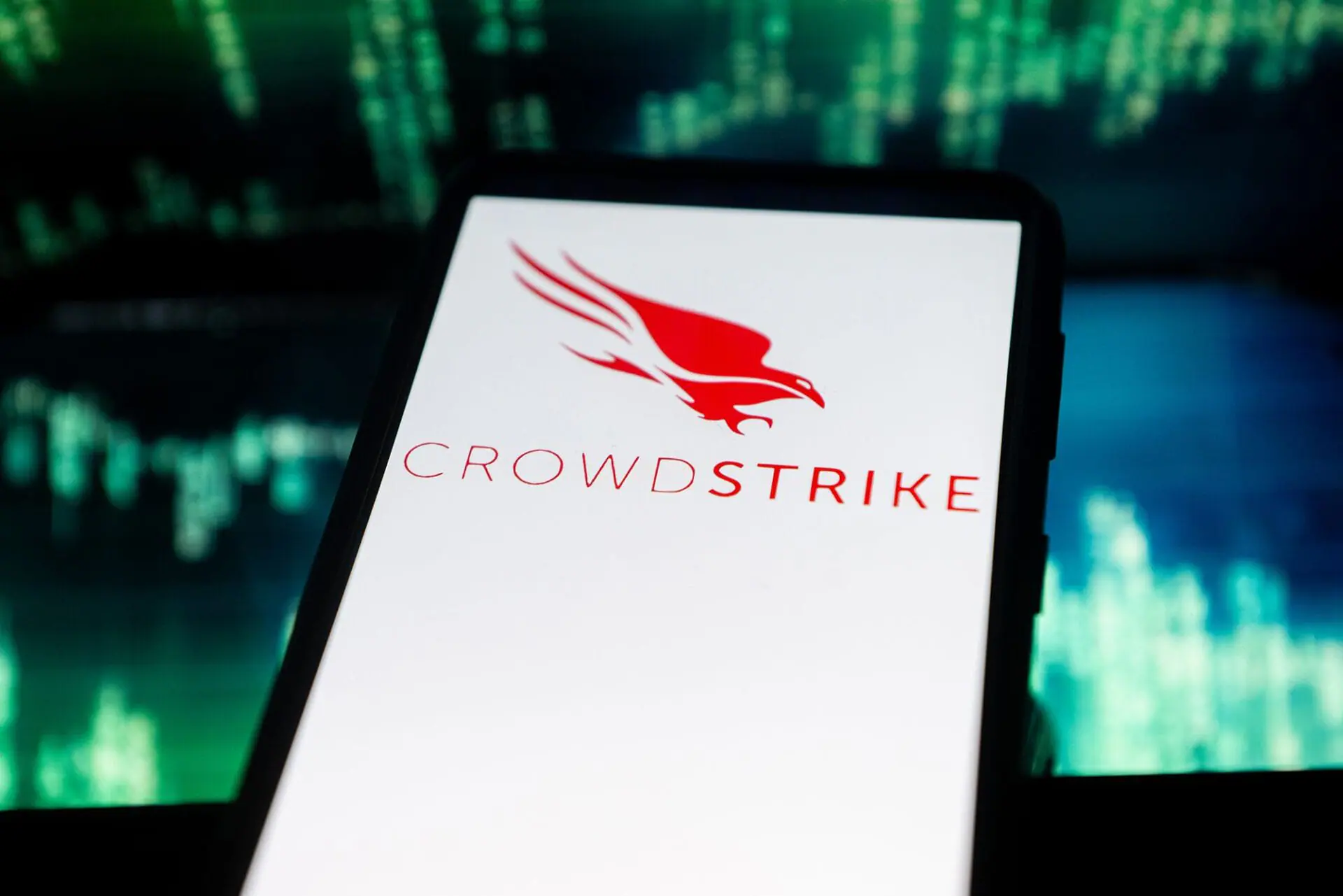 In this photo illustration a Crowdstrike logo seen displayed on a smartphone. The global computer outage affecting airports, banks and other businesses appears to stem at least partly from a software update issued by major US cybersecurity firm CrowdStrike, experts told CNN. (Photo by Mateusz Slodkowski/SOPA Images/LightRocket/Getty Images via CNN Newsource)