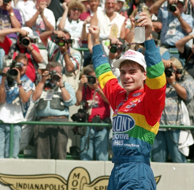 Jeff Gordon celebrates in Victory Lane at the Indianapolis Motor Speedway, Saturday, Aug. 6, 1994, after winning the first Brickyard 400 NASCAR event. (AP Photo/Tom Russo)