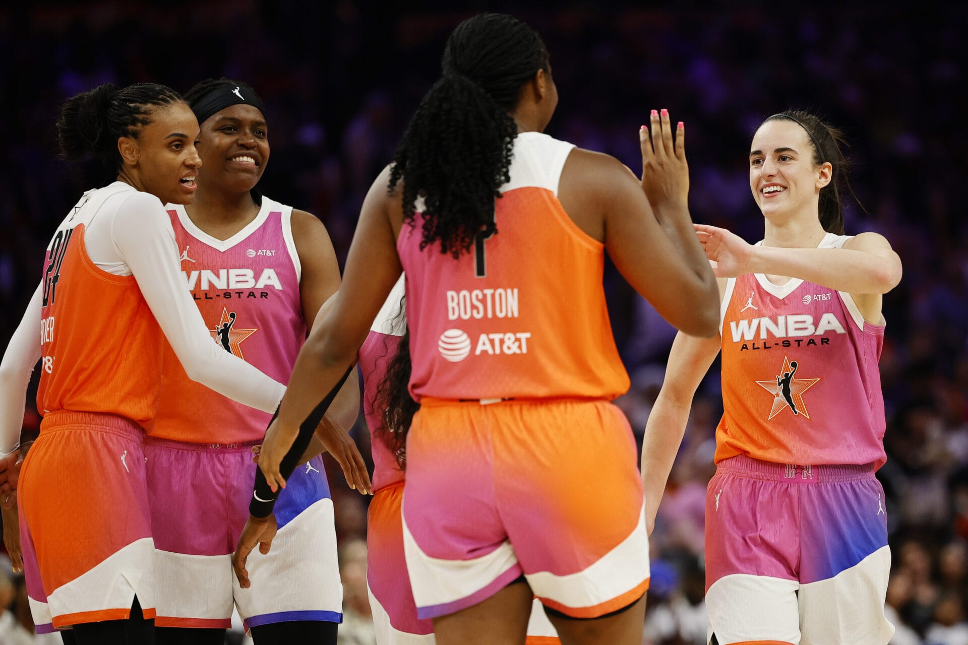 Caitlin Clark #22 of Team WNBA exchanges a high five with Indiana Fever teammate Aliyah Boston during the first half of the 2024 WNBA All Star Game at Footprint Center on July 20, 2024 in Phoenix, Arizona. (Photo by Alex Slitz/Getty Images)
