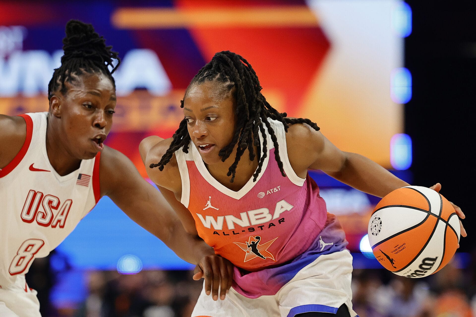 PHOENIX, ARIZONA - JULY 20: Kelsey Mitchell #0 of Team WNBA works against Chelsea Gray #8 of Team USA during the first quarter of the 2024 WNBA All Star Game at Footprint Center on July 20, 2024 in Phoenix, Arizona. (Photo by Alex Slitz/Getty Images)