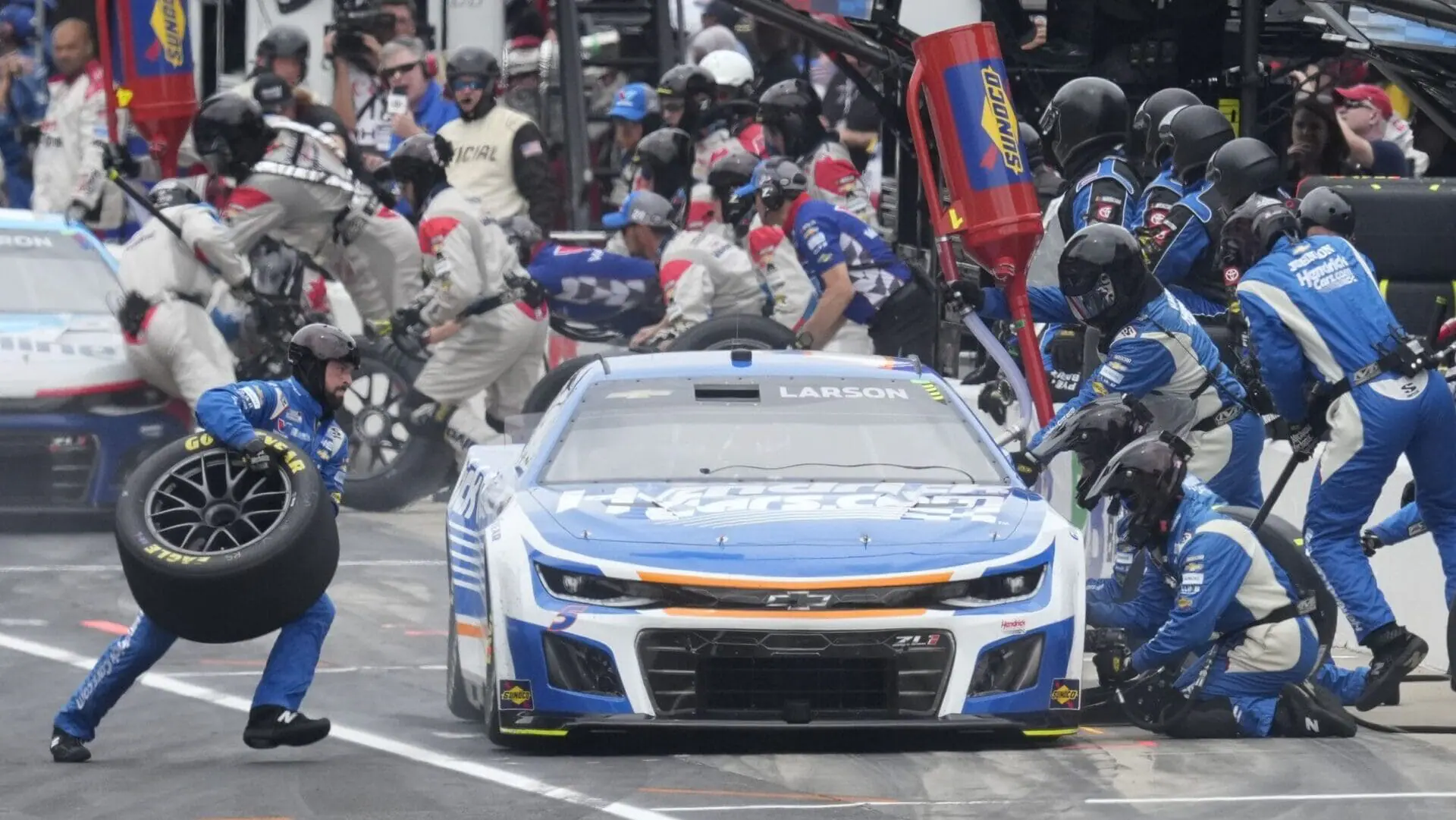 Kyle Larson makes a pit stop during a NASCAR Cup Series auto race at Indianapolis Motor Speedway, Sunday, July 21, 2024, in Indianapolis. (AP Photo/Darron Cummings)