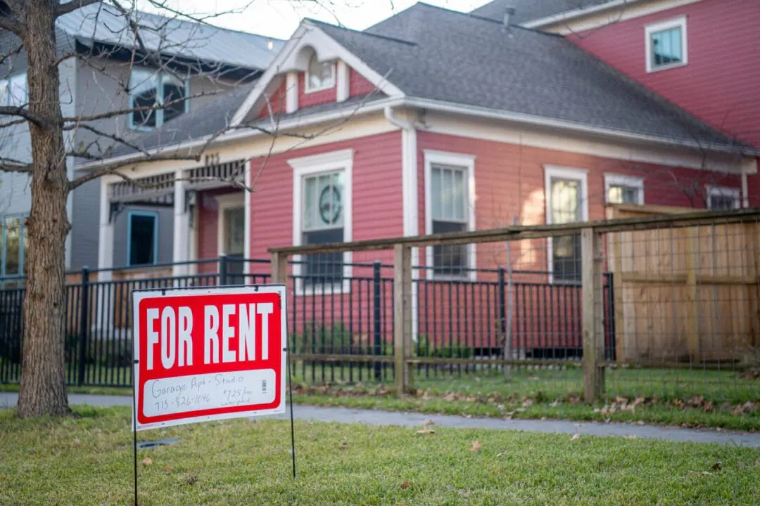 A 'For Rent' sign is posted near a home on February 07, 2022 in Houston, Texas. If you rent a house in Indianapolis, there’s a decent chance you’re paying money every month to an out-of-state investor who owns the home. (Photo by Brandon Bell/Getty Images)