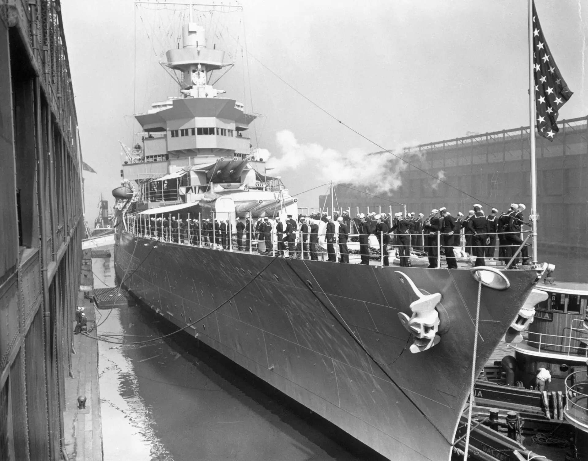 President's Reviewing Ship Leaves Dock for Ambrose. New York: The U.S.S. Indianapolis, shown leaving her dock here, May 31st, for Ambrose Lightship where she will be anchored for the Presidential Review of the United States Naval Power in many years.