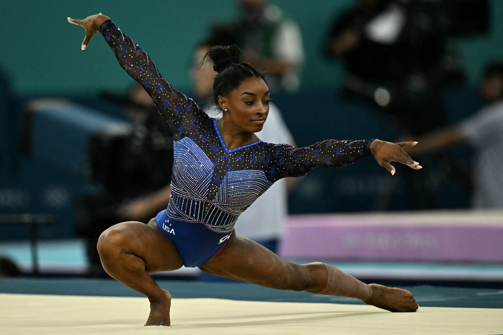 US' Simone Biles competes in the floor exercise event of the artistic gymnastics women's all around final during the Paris 2024 Olympic Games at the Bercy Arena in Paris, on August 1, 2024. (Photo by Lionel BONAVENTURE / AFP) (Photo by LIONEL BONAVENTURE/AFP via Getty Images)