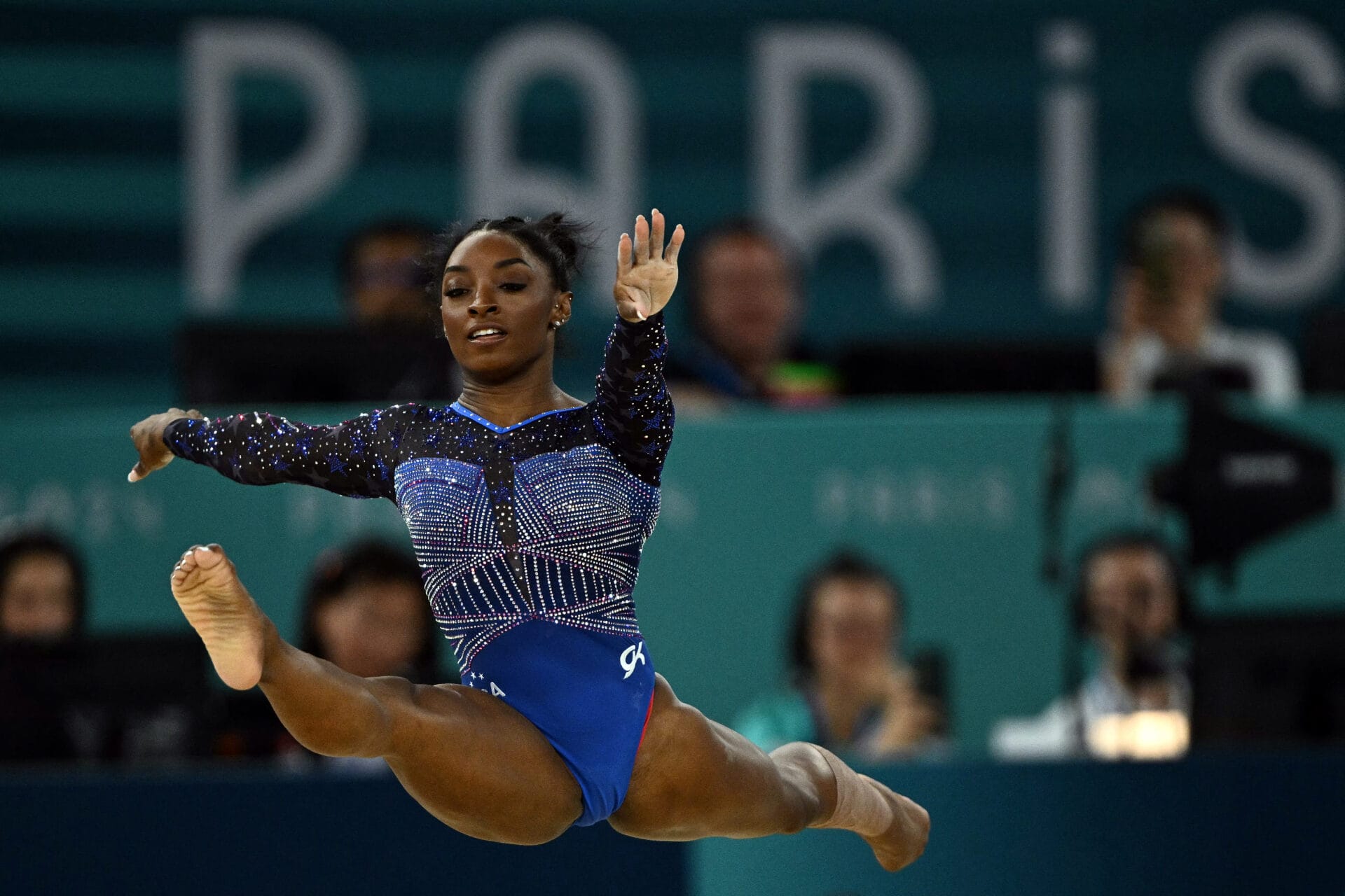 US' Simone Biles competes in the floor exercise event of the artistic gymnastics women's all around final during the Paris 2024 Olympic Games at the Bercy Arena in Paris, on August 1, 2024. (Photo by Lionel BONAVENTURE / AFP) (Photo by LIONEL BONAVENTURE/AFP via Getty Images)