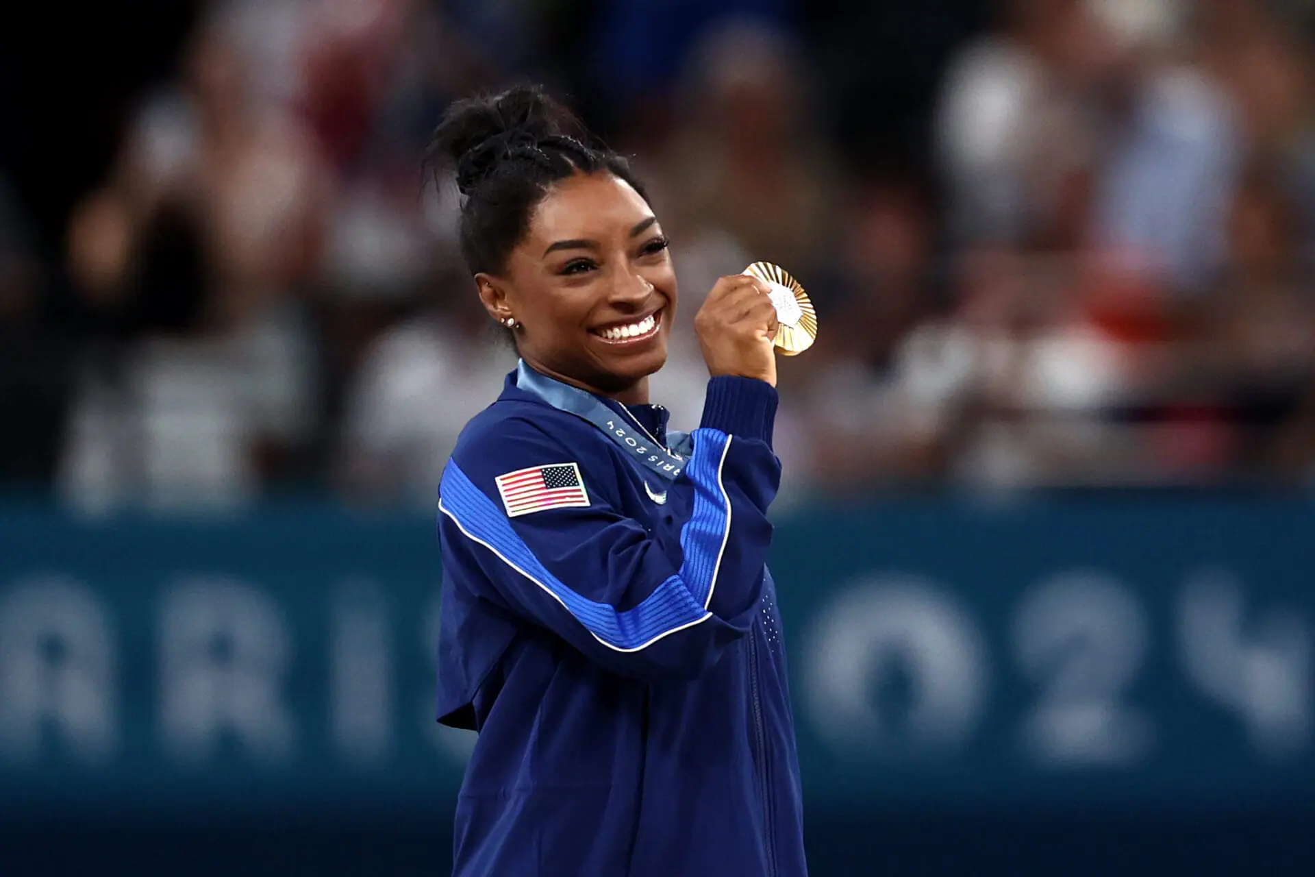 Gold medalist Simone Biles of Team United States poses with her medal after competing in the Artistic Gymnastics Women's All-Around Final on August 01, 2024 in Paris, France. We can learn mental toughness and resilience and perseverance from Olympic athletes like Biles, an IU Health psychologist says.(Photo by Naomi Baker/Getty Images)