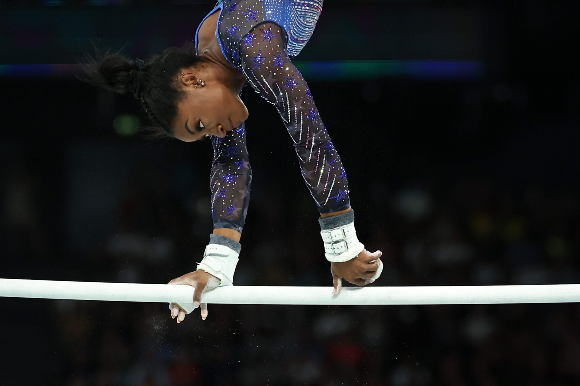 PARIS, FRANCE - AUGUST 01: Olympic Champion and Gold Medal Winner Simone Biles of Team United States competes on unever bars during the women's Artistic Gymnastics All-Around Final on day six of the Olympic Games Paris 2024 at Bercy Arena on August 01, 2024 in Paris, France. (Photo by Stefan Matzke - sampics/Getty Images)