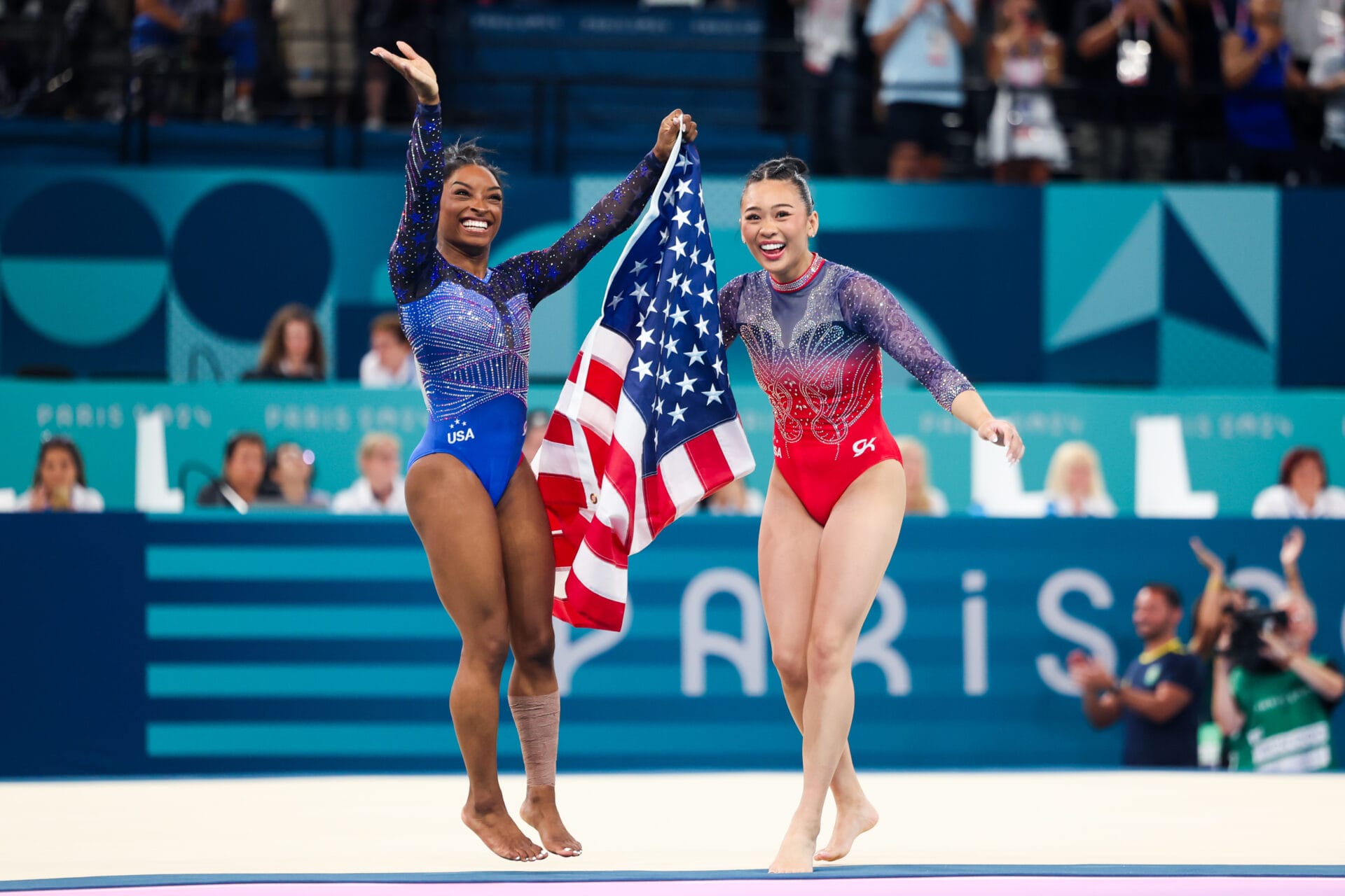 Simone Biles (L) and Sunisa Lee of Team United States celebrate after winning respectively the gold and bronze medal at the end of the Artistic Gymnastics - Women's All-Around Final on day 6 of the Paris 2024 Olympic Games at Bercy Arena on August 1, 2024 in Paris, France. (Photo by Andrzej Iwanczuk/NurPhoto via Getty Images)