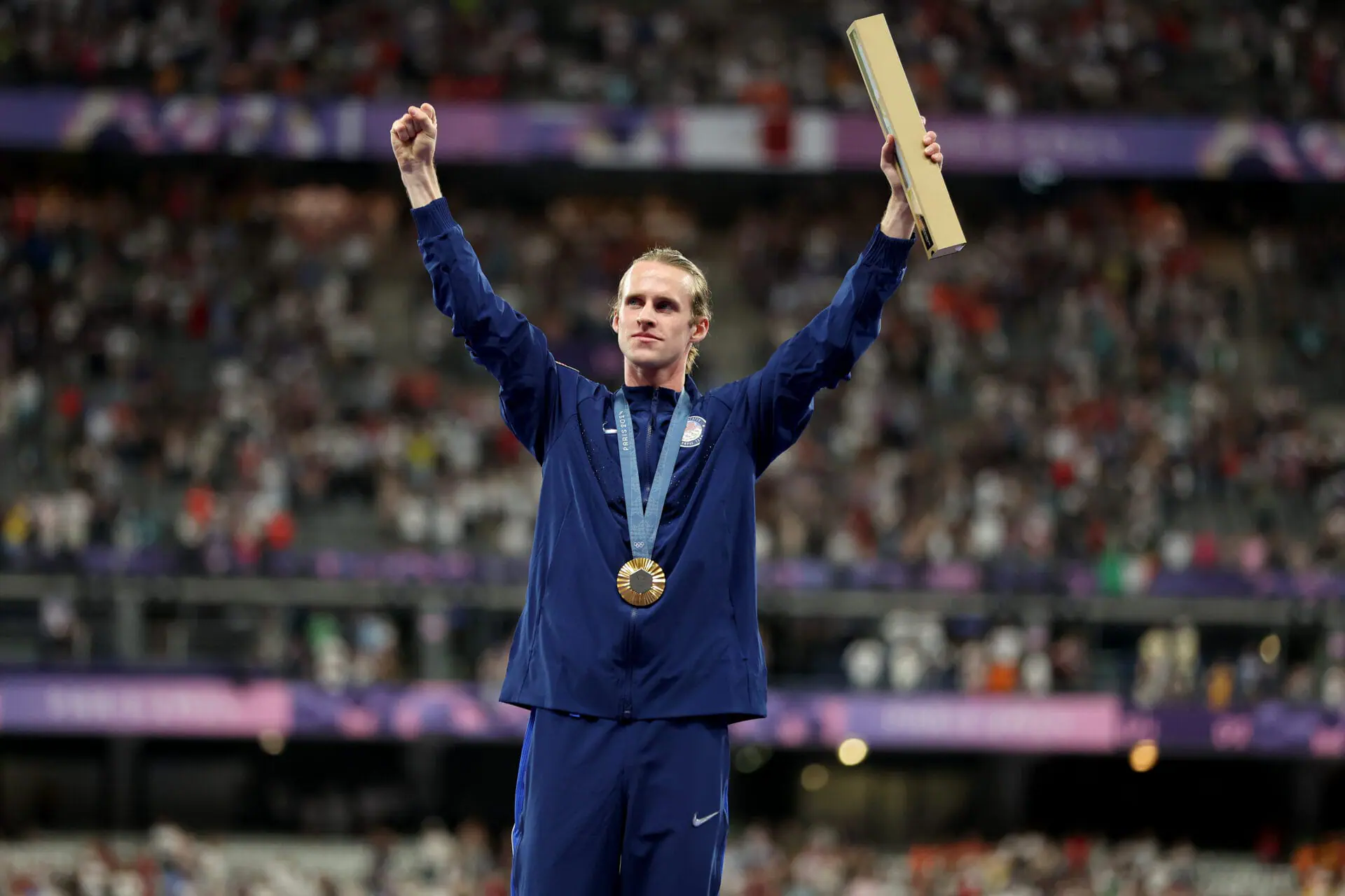 Gold medalist Cole Hocker of Team United States celebrates on the podium at the Men's 1500m Medal Ceremony on day eleven of the Olympic Games Paris 2024 at Stade de France on August 06, 2024 in Paris, France. (Photo by Hannah Peters/Getty Images)