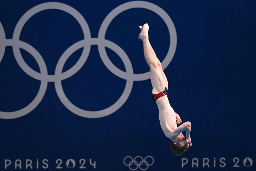 US' Carson Tyler competes in the men's 3m springboard diving semi-final during the Paris 2024 Olympic Games at the Aquatics Centre in Saint-Denis, north of Paris, on August 7, 2024. (Photo by Oli SCARFF/AFP via Getty Images)