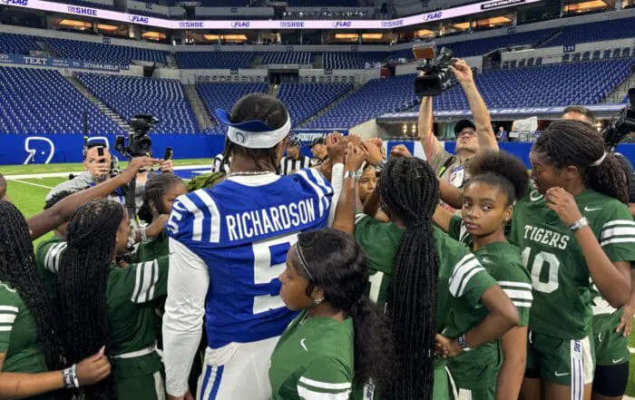 Anthony Richardson and Zaire Franklin help coach girls flag football