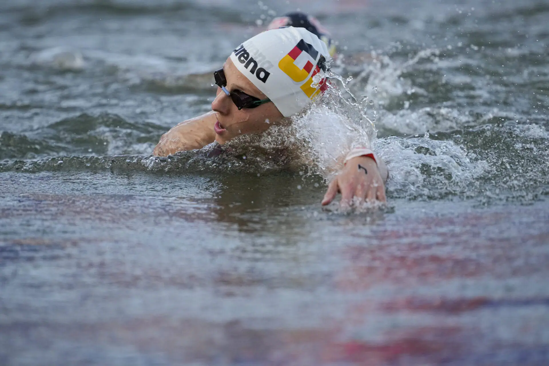 Germany's Leonie Beck competes during the marathon swimming women's 10km competition at the 2024 Summer Olympics, Thursday, Aug. 8, 2024, in Paris, France. (AP Photo/Vadim Ghirda)