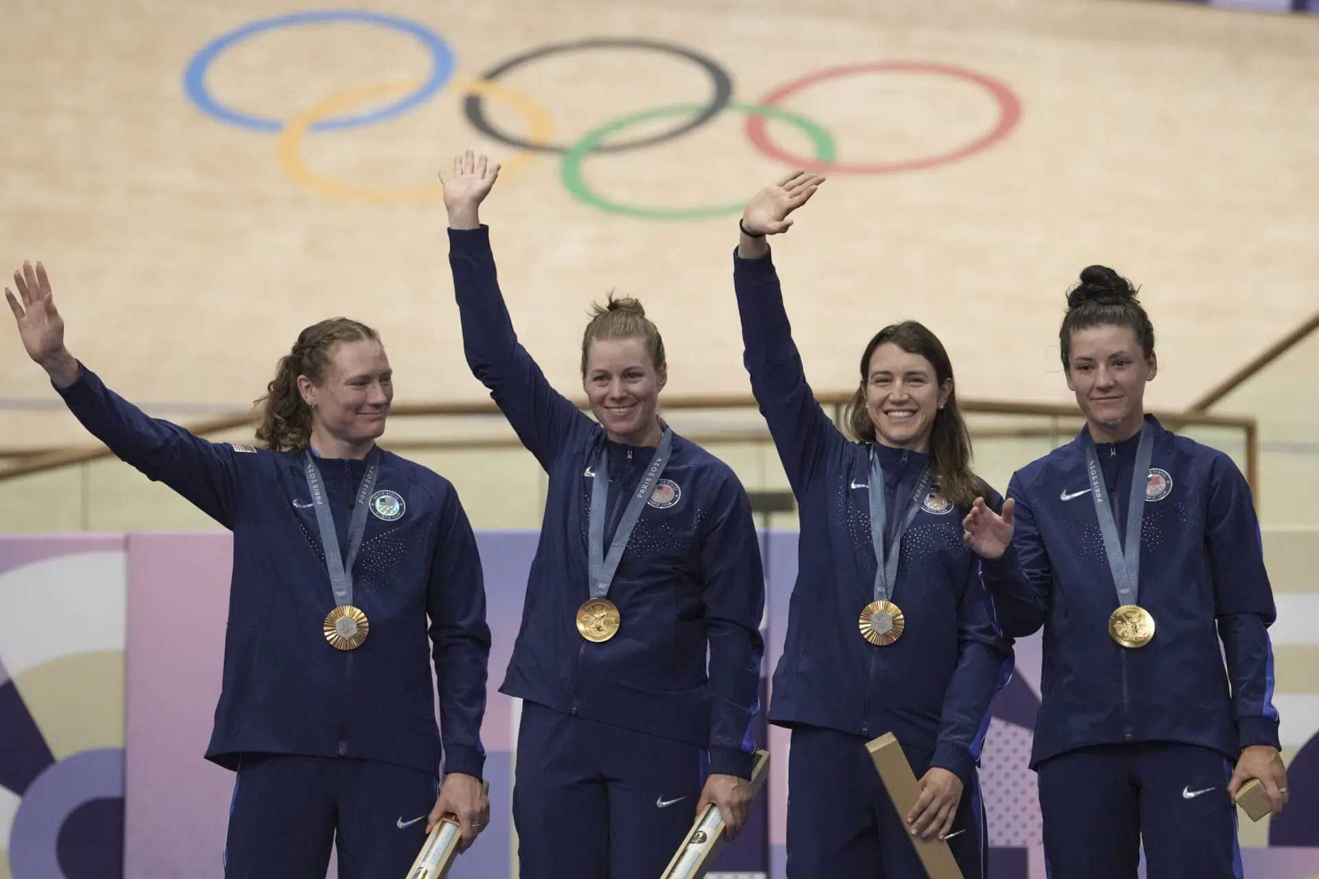 From left, United States' Lily Williams, Jennifer Valente, Kristen Faulkner and Chloe Dygert pose with the gold medal of the women's team pursuit event, at the Summer Olympics, Wednesday, Aug. 7, 2024, in Paris, France. (AP Photo/Thibault Camus)