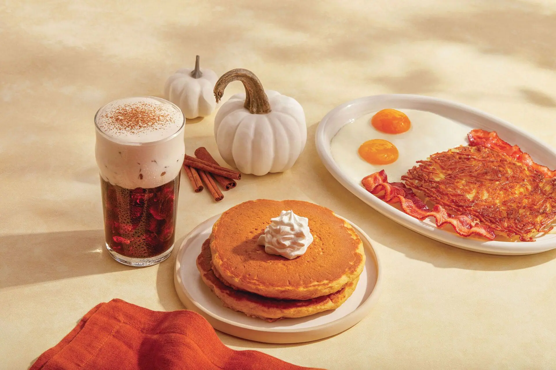 iHOP's pumpkin spice menu items are pictured in a promotional image. Is pumpkin spice a summer flavor? iHOP and Krispy Kreme say yes. (Photo by iHOP via CNN Newsource)