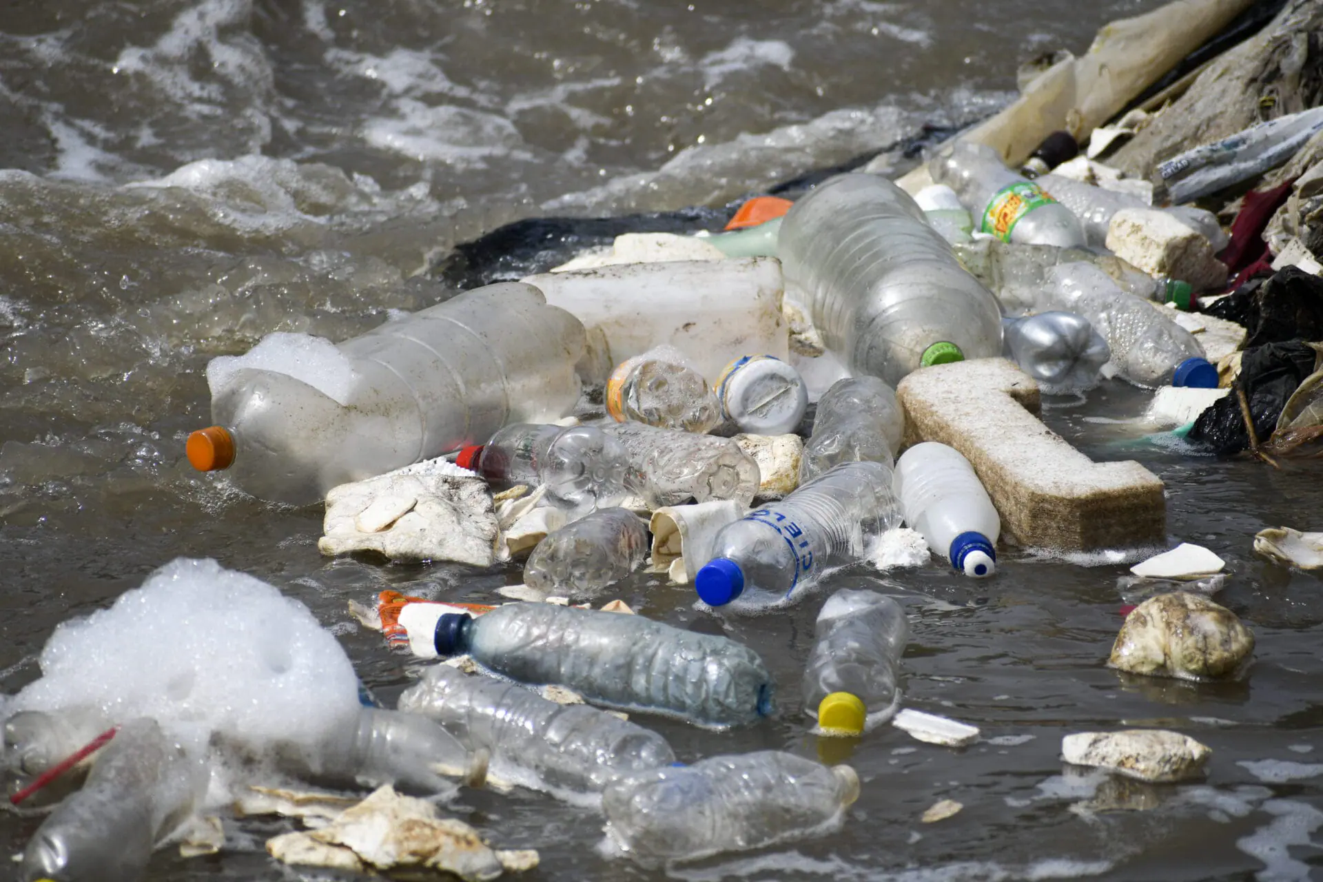 View of plastic bottles in the polluted waters of Las Vacas River, in Chinautla, Guatemala, on June 8, 2022, where the Dutch NGO The Ocean Cleanup will install The Interceptor, a giant metal fence to catch thousands of tons of plastic garbage. - The Dutch NGO The Ocean Cleanup seeks to trap thousands of tons of plastic that each year flow into the Caribbean Sea generated from the capital of Guatemala by the Las Vacas River, a tributary of the extensive Motagua River, the promoter of the project Boyan Slat, reported on Wednesday. (Photo by Johan ORDONEZ / AFP) (Photo by JOHAN ORDONEZ/AFP via Getty Images)