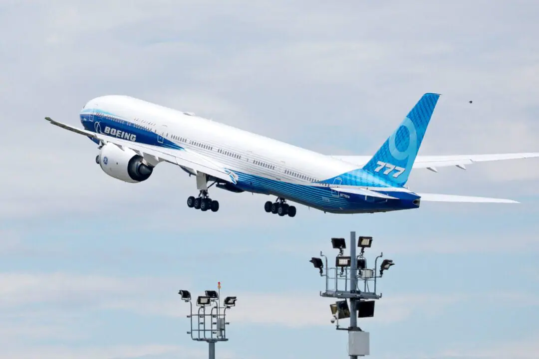 A 777X flight test aircraft takes off from Paine Field on June 26, 2024 in Everett, Washington. The 777X, Boeing's latest incarnation of the popular 777 family, has received more than 500 orders, although it has not yet entered commercial service. Boeing had originally planned for the jet to enter service in January 2020. But the timeframe has been pushed back to 2025 due to certification delays. The jet still must be certified by the US Federal Aviation Administration. (Photo by Jennifer Buchanan/AFP via Getty Images)