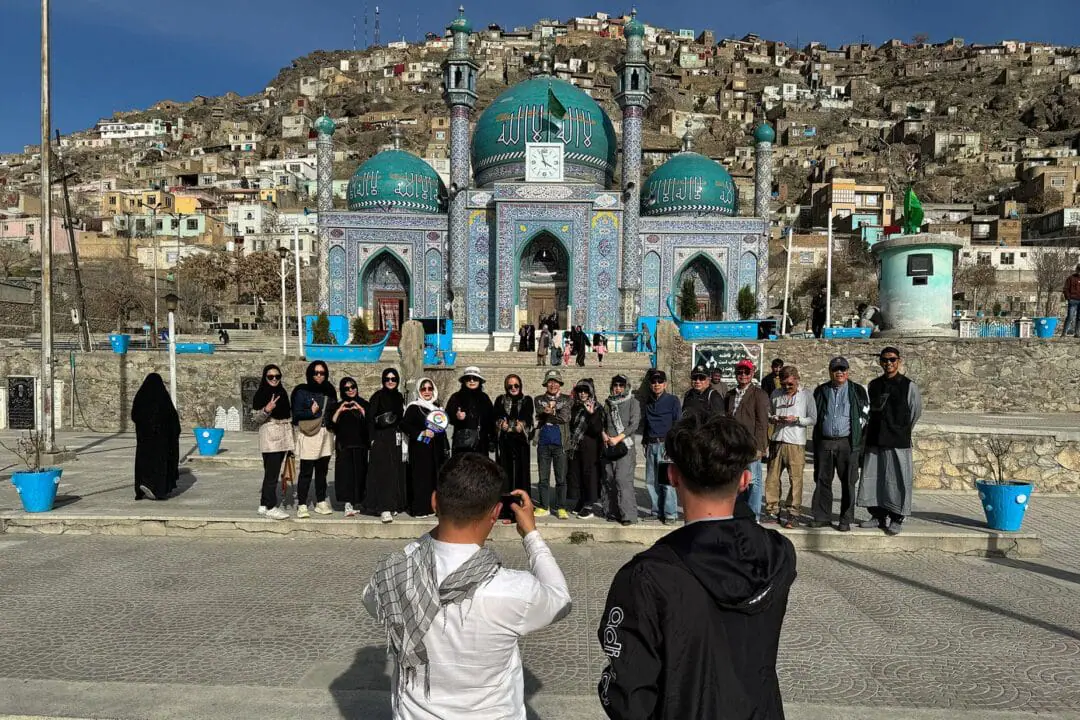 Thai tourists pose for a picture during a visit to the Kart-e-Sakhi Shrine in Kabul during a March 2024 visit. Taliban leaders say they want more people to come visit Afghanistan. (Photo by Wakil Kohsar/AFP/Getty Images via CNN Newsource)