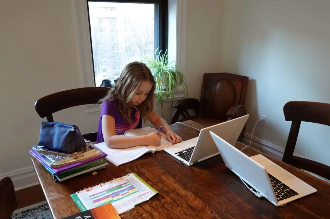 Schoolgirl using a laptop working on a table from home on March 16, 2020. The second annual Indiana Girl Report — seeks to evaluate the wellbeing of girls statewide, with breakdowns on differences between the state’s regions. =(Photo by Peter Titmuss/Education Images/Universal Images Group via Getty Images)