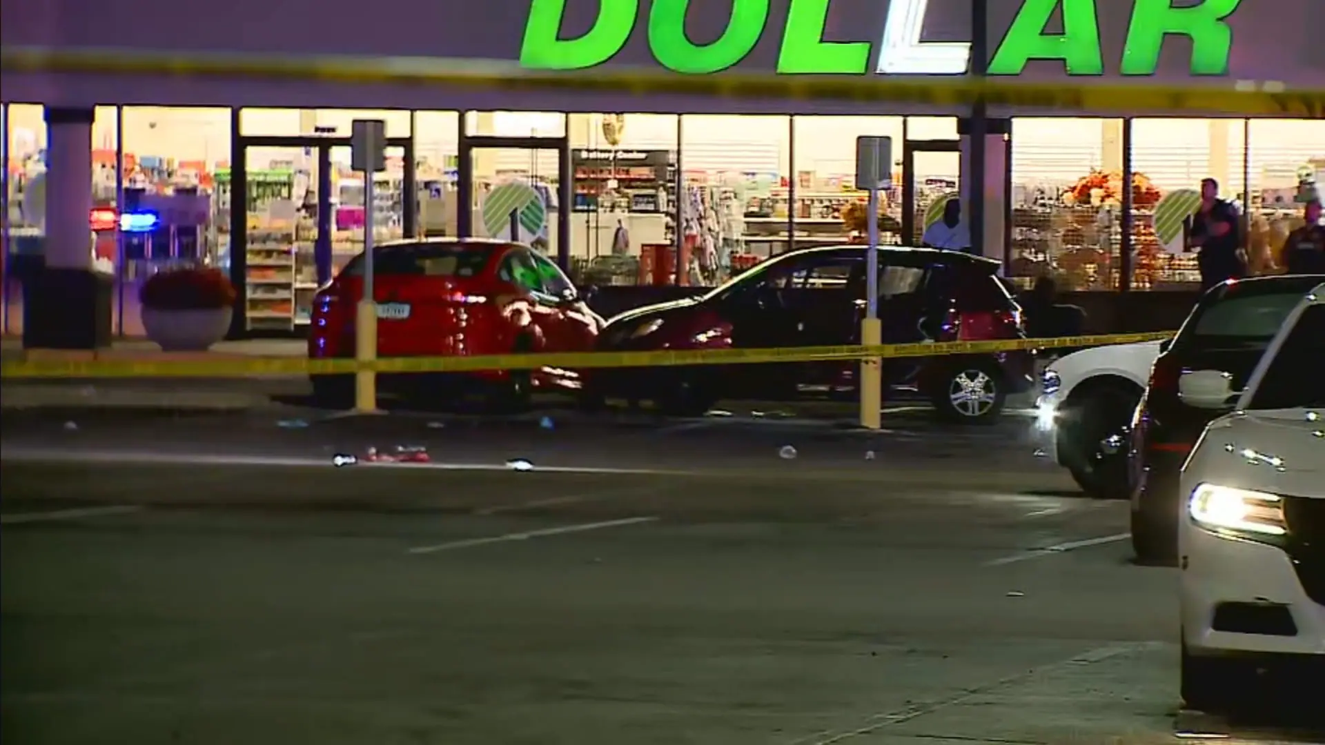 Medics and IMPD investigators at a double murder scene at the Shadeland Station Shopping Center on Aug. 26, 2024. Police say William Paschall-Young, 22, was arrested on Nov. 16, 2024, for his role in the deaths of Jaishawn Johnson, 22, and Armonie Booker, 3.