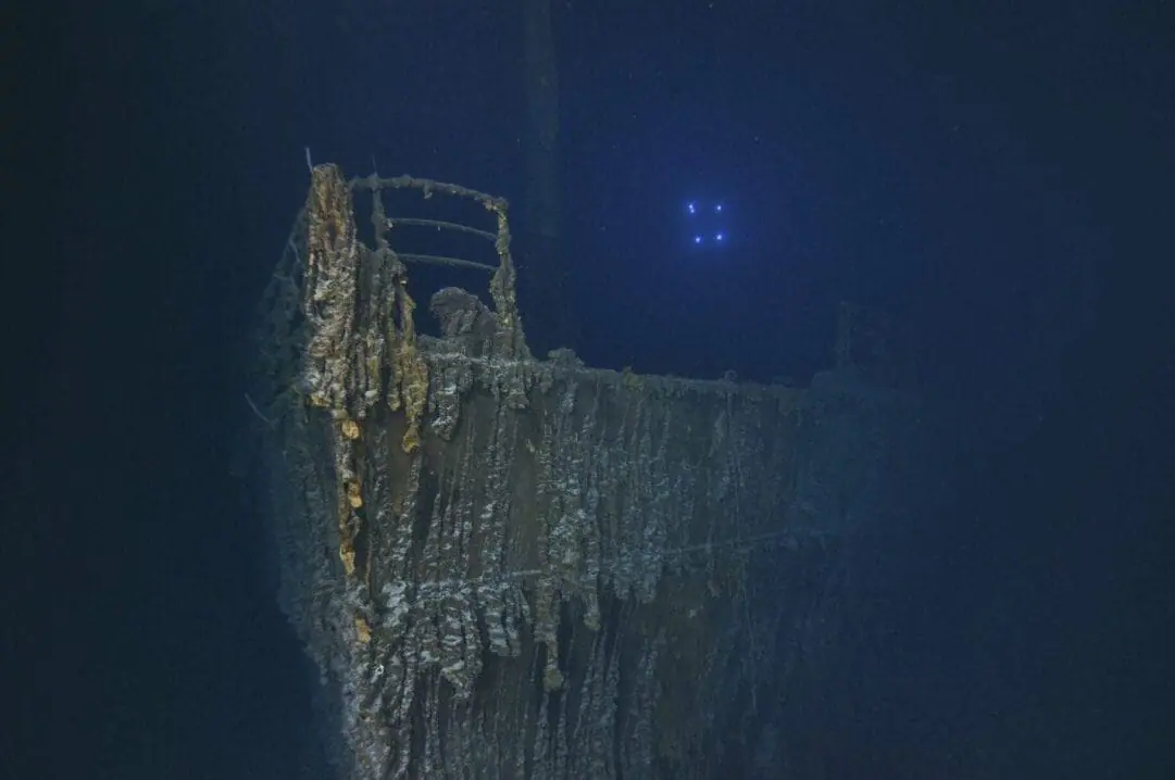 This image released on Monday, Sept. 2, 2024, shows the bow of the Titanic with a large section of the deck railing now missing photographed this summer by a company with salvage rights to the wreck site on its first expedition there in many years. (RMS Titanic Inc. via AP)