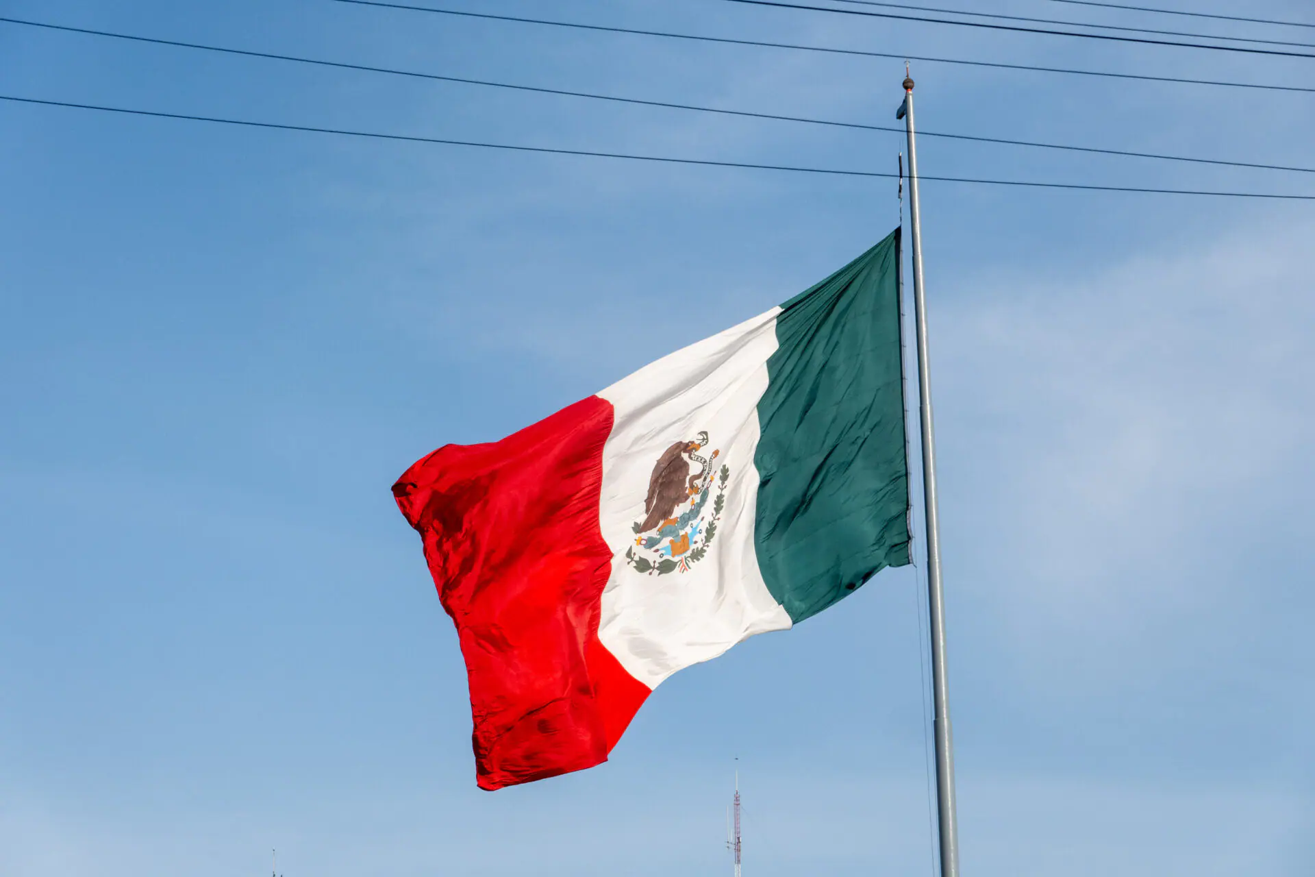 Mexican flag flying at Zócalo in Mexico City. (Photo by Shawn Goldberg/SOPA Images/LightRocket via Getty Images)