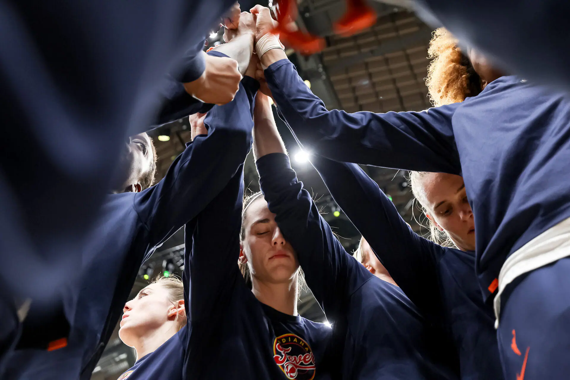 Caitlin Clark #22 of the Indiana Fever gathers with her teammates before the game against the Seattle Storm at Climate Pledge Arena on June 27, 2024 in Seattle, Washington. (Photo by Steph Chambers/Getty Images)