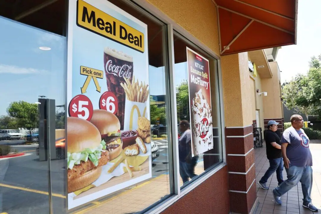 A sign advertises meal deals at a McDonald's restaurant on July 22, in Burbank, California. McDonald's says its $5 value meal, introduced in June 2024, will stick around until December. (Photo by Mario Tama/Getty Images via CNN Newsource)