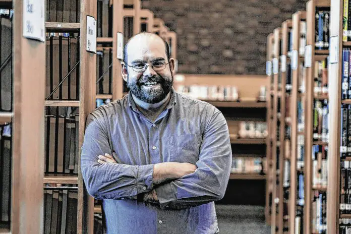 Jason Hatton, director of the Bartholomew County Public Library, is shown near the front desk. (Provided Photo/The Republic)