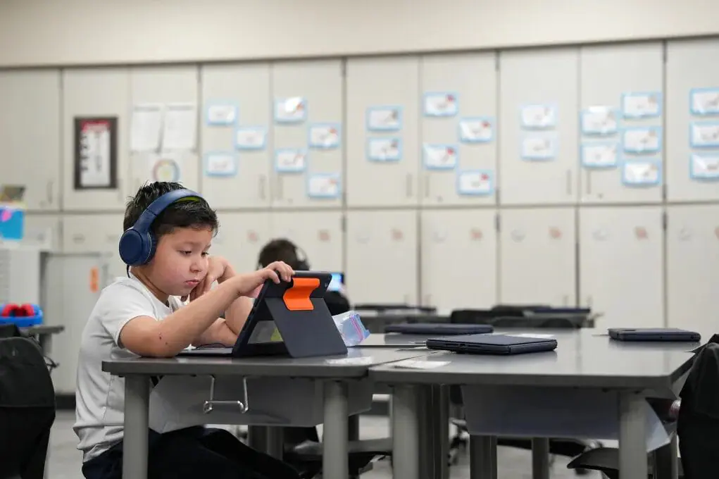 First grader Nelson Perla uses an iPad to work through a Lexia reading lesson Sept. 9, 2024, at Pleasant Run Elementary School in Indianapolis.