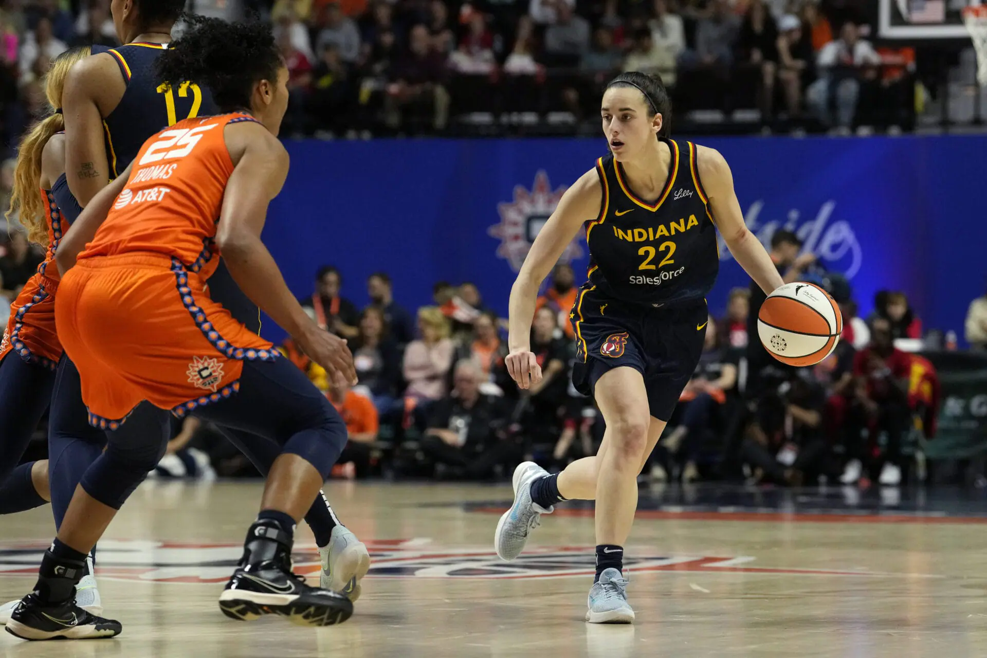 Caitlin Clark #22 of the Indiana Fever advances the ball during the second half of a first-round WNBA playoff game against the Connecticut Sun at Mohegan Sun Arena on September 22, 2024 in Uncasville, Connecticut. The Sun defeated the Fever 93-69. (Photo by Joe Buglewicz/Getty Images)