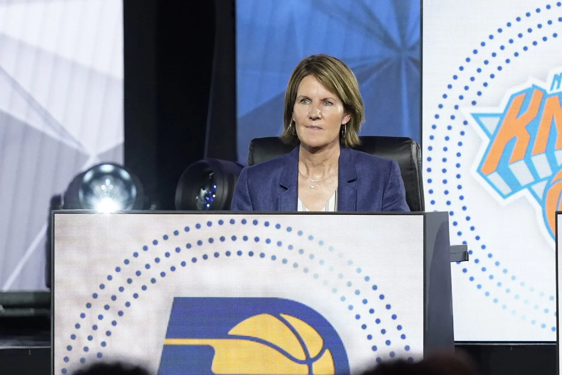 FILE - Kelly Krauskopf sits on stage during the 2022 NBA basketball Draft Lottery, May 17, 2022, in Chicago. (AP Photo/Charles Rex Arbogast, file)