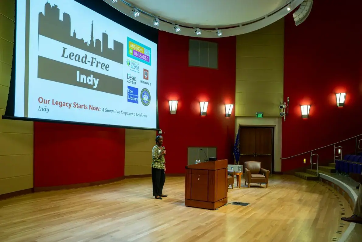 Karla Johnson, administrator at Marion County Public Health Department, opens the “Our Legacy Starts Now: A Summit to Empower a Lead-Free Indy” event. Community leaders and organizers gathered Sept. 19, 2024, at Indianapolis Public Library Central Branch to discuss ways to curb children’s exposure to lead. (Provided Photo/Doug McSchooler for Mirror Indy)