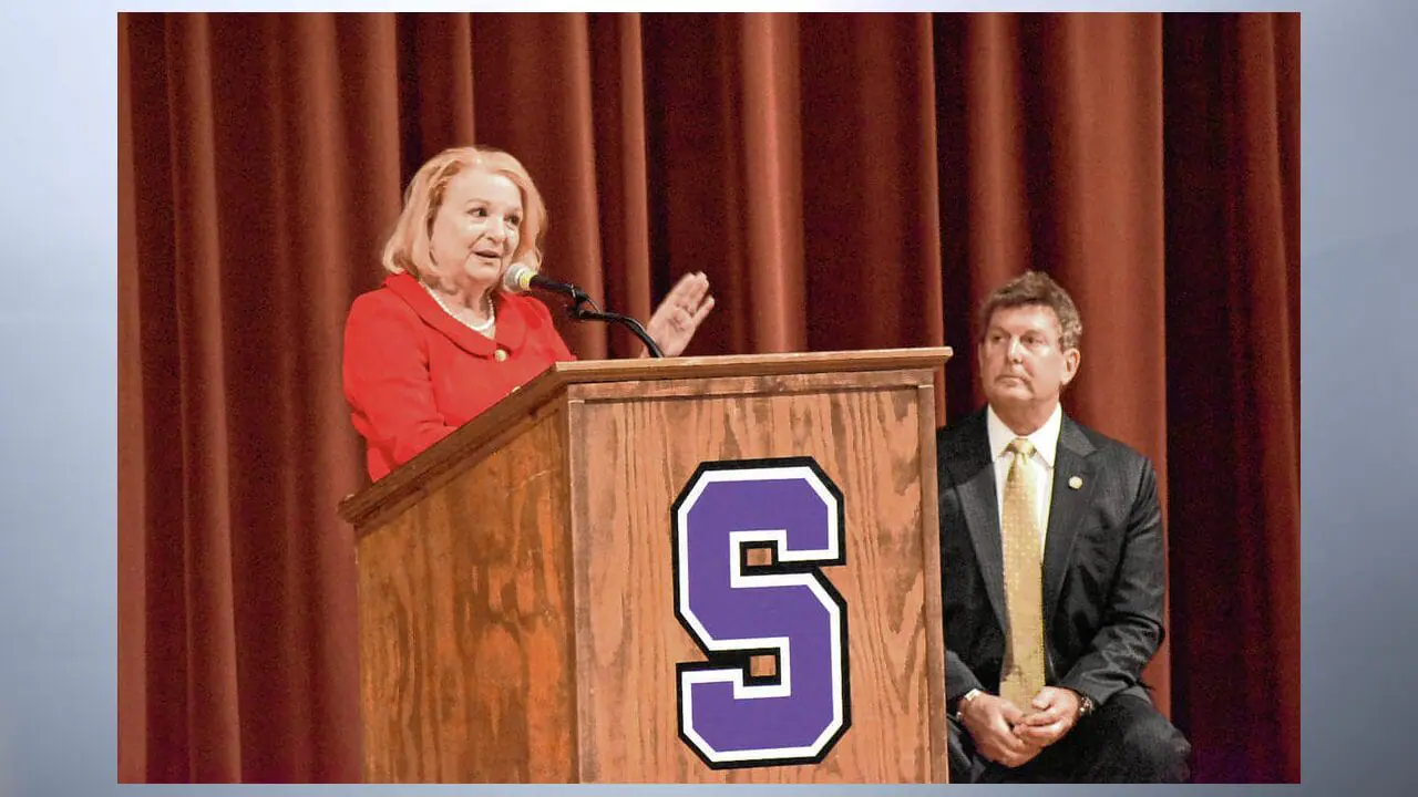 Trish Whitcomb, (Seymour-D) speaks as her opponent, Indiana Rep. Jim Lucas, (Seymour-R), watches her during the House District 69 debate Wednesday night at the Seymour High School auditorium. (Photo by Chey Smith/The Tribune)