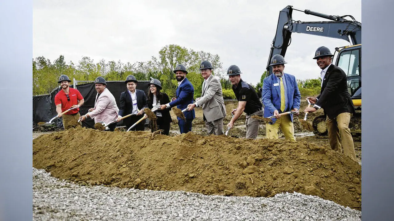 Greenwood Village South officials, partners and Greenwood Mayor Mark Myers turn shovels of dirt during a groundbreaking ceremony on Monday for the start of a new road to access to the facility. The new road is the precursor for a $100 million expansion project that will include a flurry of new living options and amenities. (Photo by Ryan Trares/Daily Journal)