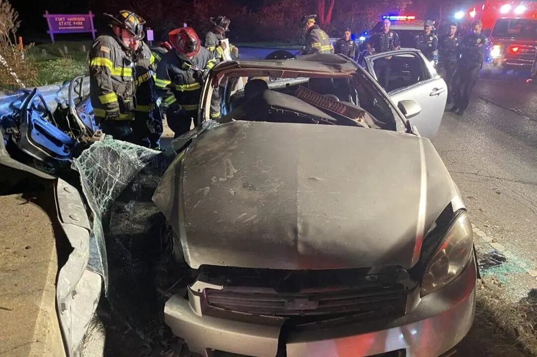 Two injured men had to be cut out of a vehicle early Thursday morning after a single-vehicle crash near the entrance to Fort Harrison State Park in Lawrence. (Provided Photo/Lawrence Fire Department)