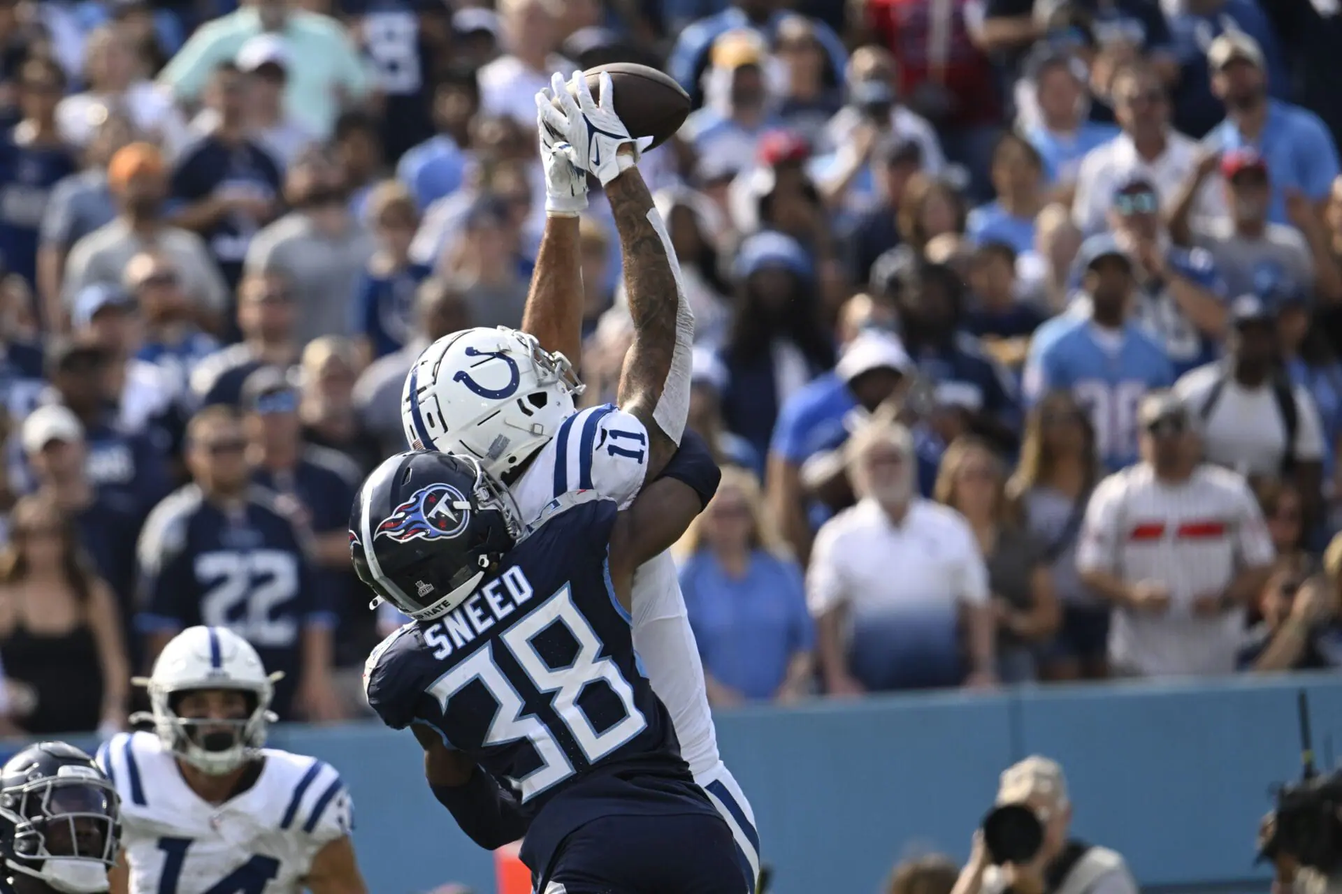 Indianapolis Colts wide receiver Michael Pittman Jr. (11) makes a touchdown catch against Tennessee Titans' L'Jarius Sneed (38) during the second half of an NFL football game, Sunday, Oct. 13, 2024, in Nashville, Tenn. (AP Photo/John Amis)